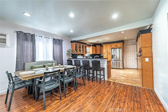 4639 Pine St, Pico Rivera, CA 90660 - dining space featuring light wood-style floors, a wall mounted AC, and recessed lighting