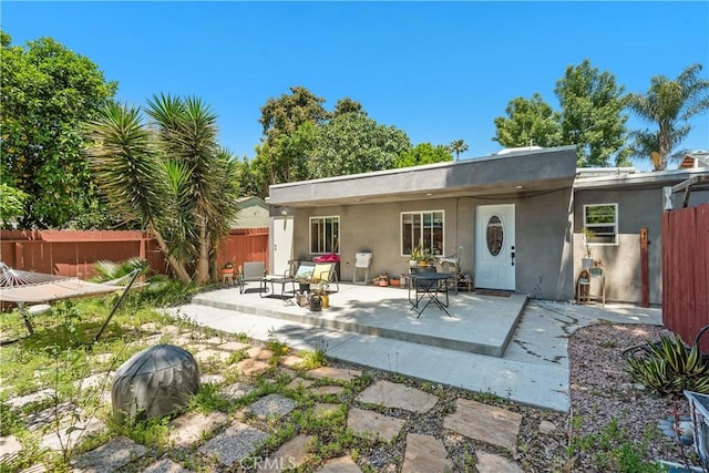 5919 Cantaloupe Ave, Valley Glen, CA 91401 - rear view of house featuring a patio area and stucco siding