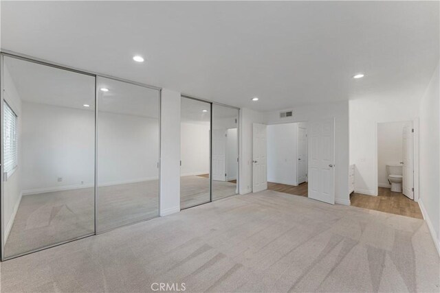4252 Brookside St, Irvine, CA 92604 - unfurnished bedroom with multiple closets, carpet, recessed lighting, ensuite bathroom, and baseboards