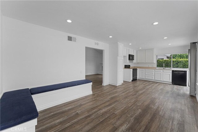 4252 Brookside St, Irvine, CA 92604 - unfurnished living room with dark wood-style flooring, recessed lighting, a sink, and baseboards