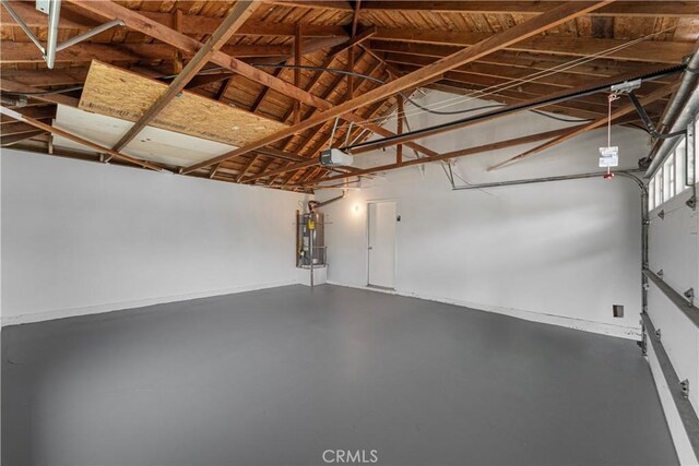4252 Brookside St, Irvine, CA 92604 - garage featuring a garage door opener and secured water heater