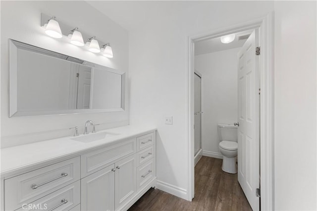 4252 Brookside St, Irvine, CA 92604 - full bath featuring toilet, wood finished floors, a stall shower, vanity, and baseboards