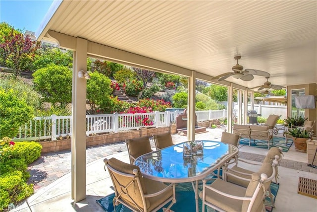 2012 Melbourne Cir, Banning, CA 92220 - fenced backyard with outdoor dining area, a patio area, and a ceiling fan
