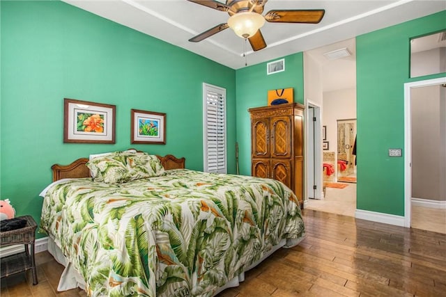2012 Melbourne Cir, Banning, CA 92220 - bedroom with hardwood / wood-style floors, baseboards, ceiling fan, and ensuite bath
