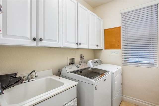 2012 Melbourne Cir, Banning, CA 92220 - washroom featuring separate washer and dryer, cabinet space, and baseboards