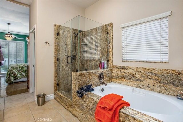 2012 Melbourne Cir, Banning, CA 92220 - full bath featuring a garden tub, a shower stall, tile patterned floors, ceiling fan, and baseboards