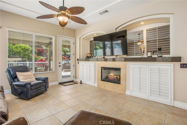 2012 Melbourne Cir, Banning, CA 92220 - living area featuring tile patterned floors, ceiling fan, and a fireplace