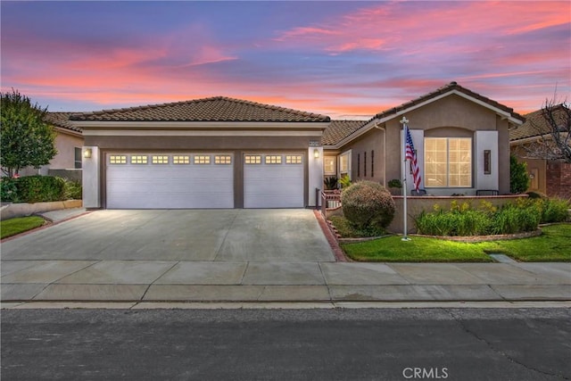 2012 Melbourne Cir, Banning, CA 92220 - view of front of property featuring stucco siding, a garage, concrete driveway, and a tile roof