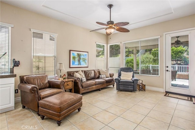 2012 Melbourne Cir, Banning, CA 92220 - living room featuring ceiling fan, light tile patterned flooring, and baseboards