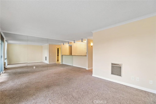 3605 W Hidden Ln Unit 112, Rolling Hills Estates, CA 90274 - carpeted spare room featuring a textured ceiling, crown molding, heating unit, and baseboards