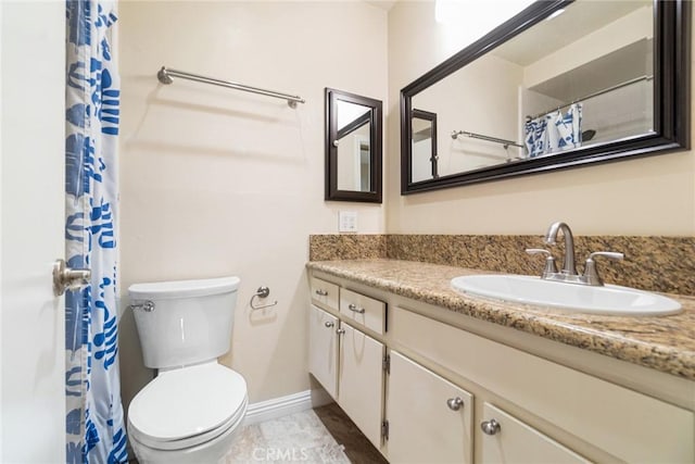 3605 W Hidden Ln Unit 112, Rolling Hills Estates, CA 90274 - full bathroom with vanity, toilet, baseboards, and a shower with shower curtain