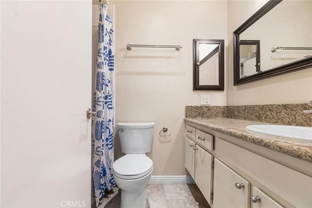 3605 W Hidden Ln Unit 112, Rolling Hills Estates, CA 90274 - bathroom featuring toilet, vanity, baseboards, and a shower with curtain