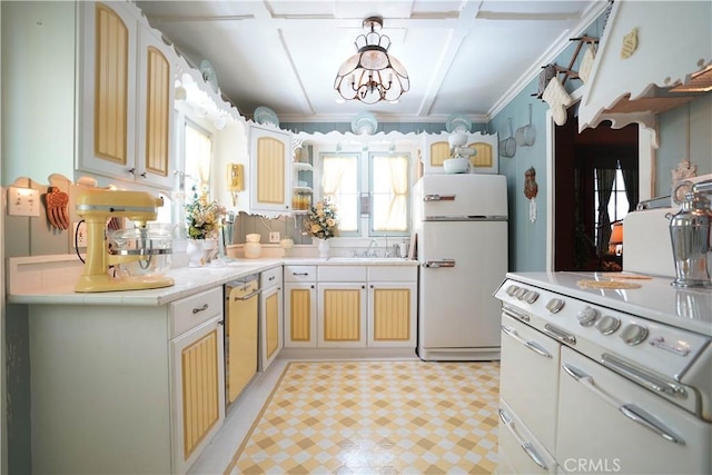 26335 Forest Ln, Twin Peaks, CA 92391 - kitchen featuring freestanding refrigerator, light countertops, dishwashing machine, a chandelier, and a sink