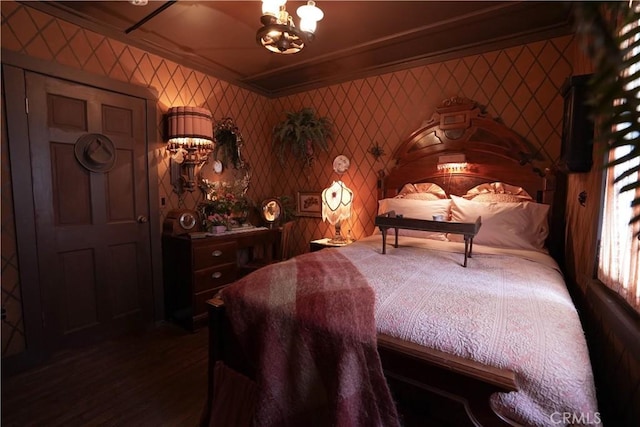 26335 Forest Ln, Twin Peaks, CA 92391 - bedroom featuring a chandelier, wood finished floors, ornamental molding, and wallpapered walls