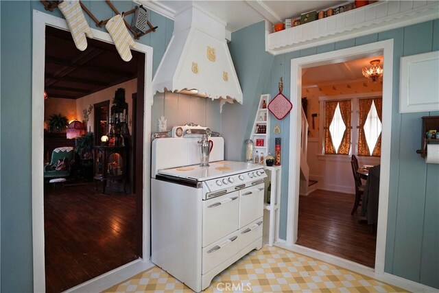 26335 Forest Ln, Twin Peaks, CA 92391 - kitchen with light wood-style flooring, white cabinets, and beam ceiling