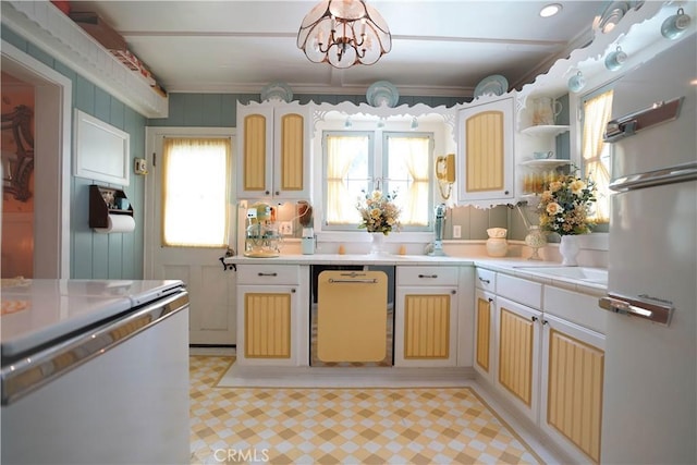 26335 Forest Ln, Twin Peaks, CA 92391 - kitchen with freestanding refrigerator, light countertops, a chandelier, and dishwasher