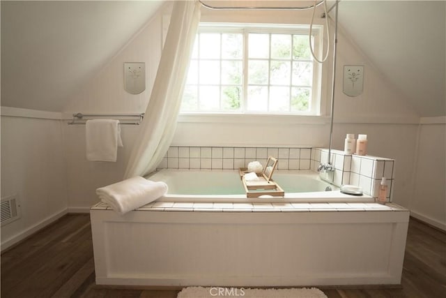 26335 Forest Ln, Twin Peaks, CA 92391 - bathroom with a garden tub, vaulted ceiling, and wood finished floors