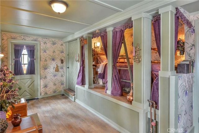 26335 Forest Ln, Twin Peaks, CA 92391 - interior space with wallpapered walls, wood-type flooring, and decorative columns