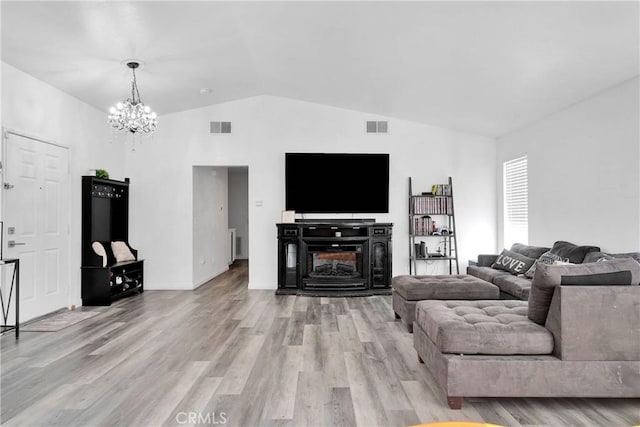 16229 Lake View Ln, Apple Valley, CA 92307 - living area with lofted ceiling, a chandelier, light wood-style flooring, and baseboards