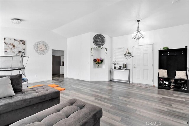 16229 Lake View Ln, Apple Valley, CA 92307 - living area featuring vaulted ceiling, wood finished floors, a chandelier, and baseboards