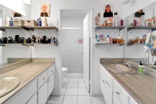 16229 Lake View Ln, Apple Valley, CA 92307 - bathroom featuring vanity, toilet, tile patterned floors, and a stall shower