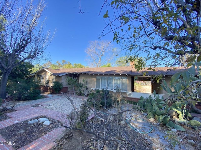 10315 Mcbroom St, Sunland, CA 91040 - rear view of house with a chimney
