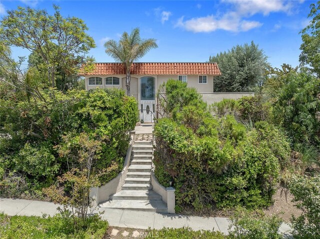 4354 Avenida Prado, Thousand Oaks, CA 91360 - mediterranean / spanish-style house with stairs, a tiled roof, and stucco siding
