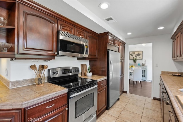 4354 Avenida Prado, Thousand Oaks, CA 91360 - kitchen featuring stainless steel appliances, open shelves, light tile patterned floors, tile countertops, and recessed lighting