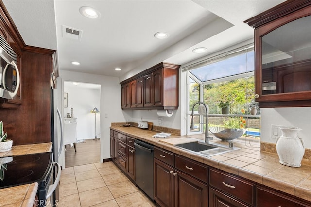 4354 Avenida Prado, Thousand Oaks, CA 91360 - kitchen featuring dishwashing machine, a sink, recessed lighting, electric range oven, and light tile patterned floors