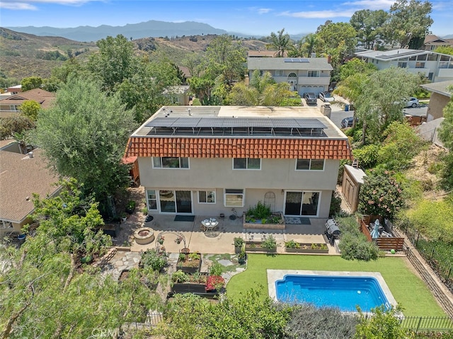 4354 Avenida Prado, Thousand Oaks, CA 91360 - back of property with stucco siding, solar panels, and a mountain view