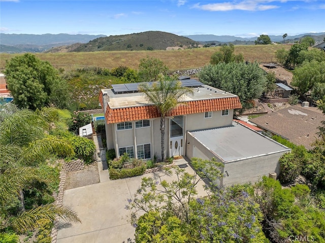 4354 Avenida Prado, Thousand Oaks, CA 91360 - view of front of property featuring stucco siding, solar panels, a tiled roof, and a mountain view