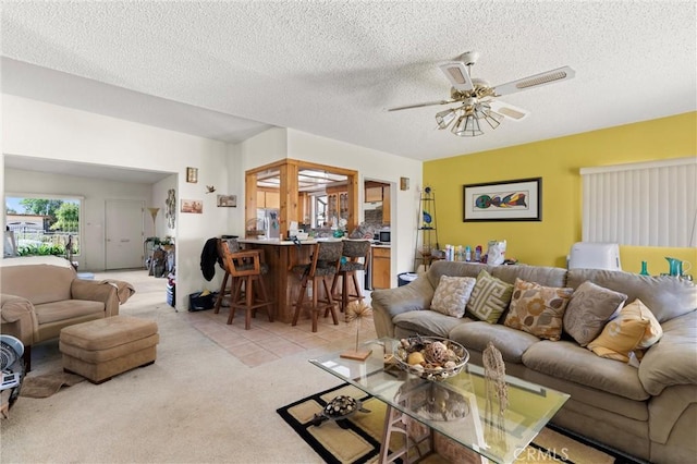 1601 163rd St W, Compton, CA 90220 - living area with a ceiling fan, light colored carpet, and a textured ceiling