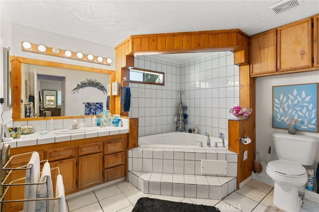 1601 163rd St W, Compton, CA 90220 - full bath featuring tile patterned floors, tiled tub, vanity, toilet, and a textured ceiling