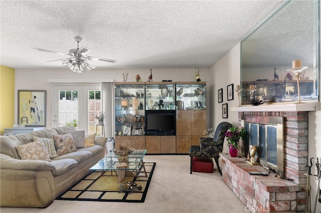 1601 163rd St W, Compton, CA 90220 - living area featuring a textured ceiling, ceiling fan, carpet floors, and a fireplace