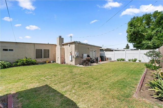 1601 163rd St W, Compton, CA 90220 - back of house featuring a patio area, a chimney, and stucco siding