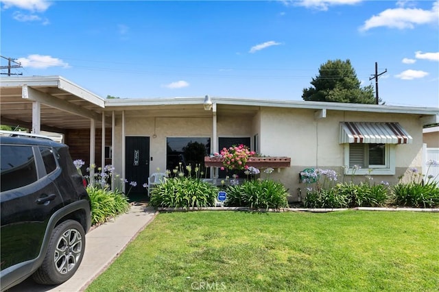 1601 163rd St W, Compton, CA 90220 - view of front of house with stucco siding, a front yard, and a carport