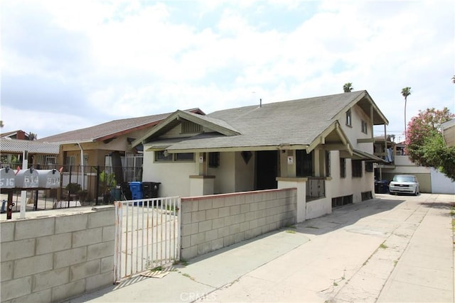 614 W 60th St, Los Angeles, CA 90044 - view of front of house with stucco siding and a shingled roof
