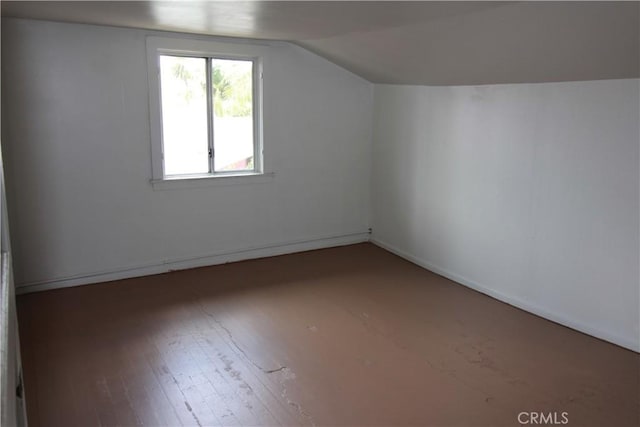 614 W 60th St, Los Angeles, CA 90044 - bonus room with lofted ceiling, wood finished floors, and baseboards