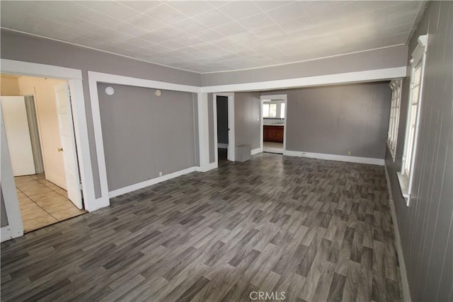614 W 60th St, Los Angeles, CA 90044 - unfurnished room featuring dark wood-type flooring and baseboards
