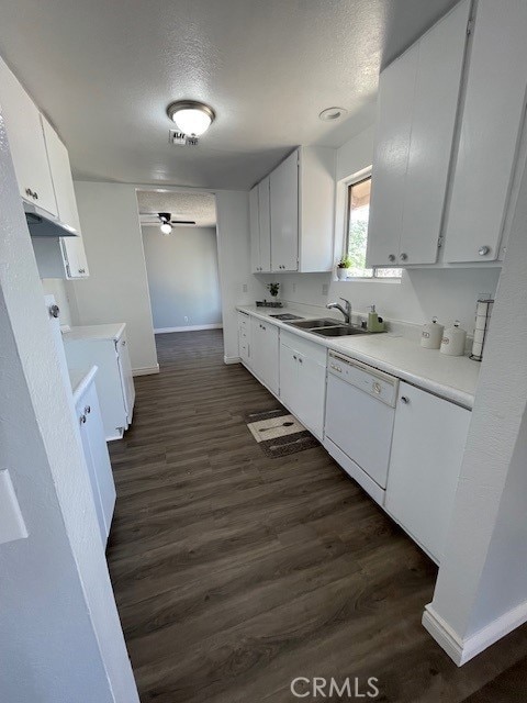 15577 Nisqualli Rd, Victorville, CA 92395 - kitchen featuring white dishwasher, ceiling fan, washer / dryer, dark wood-style floors, and a textured ceiling