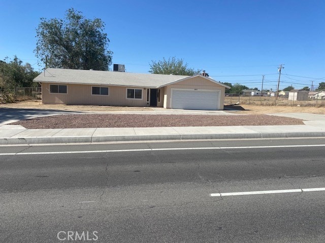 15577 Nisqualli Rd, Victorville, CA 92395 - ranch-style home featuring a garage and concrete driveway