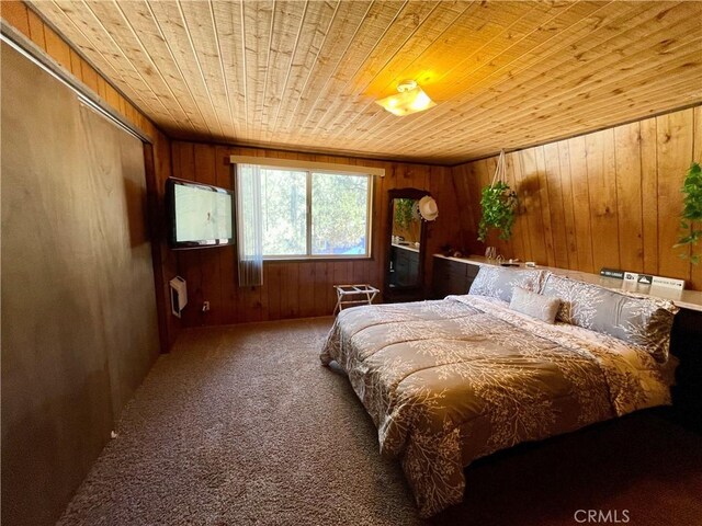 2076 8th Ln, Big Bear City, CA 92314 - carpeted bedroom with wooden ceiling and wood walls