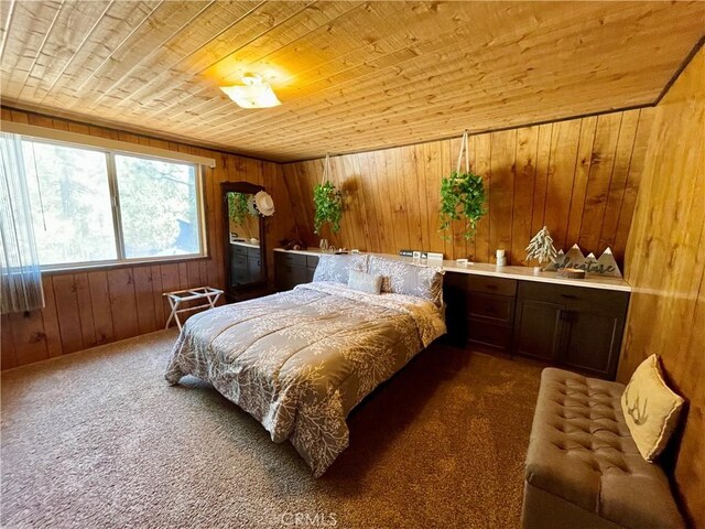 2076 8th Ln, Big Bear City, CA 92314 - carpeted bedroom with wooden ceiling and wood walls