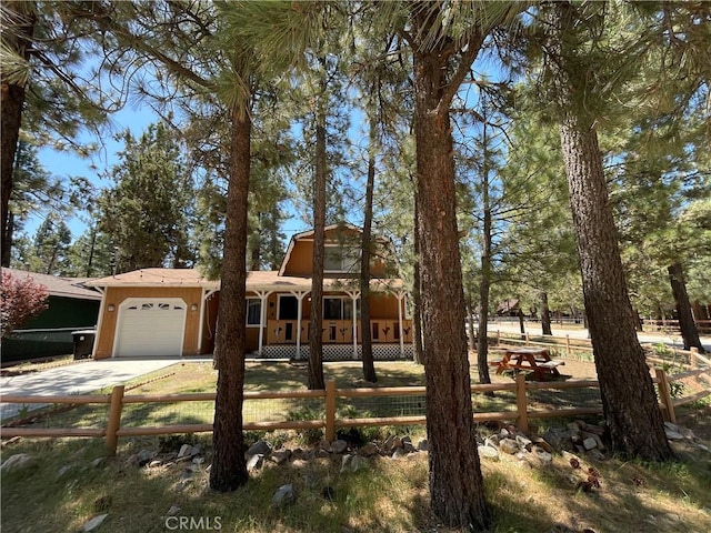 2076 8th Ln, Big Bear City, CA 92314 - view of front of property with an attached garage and concrete driveway
