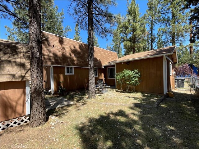 2076 8th Ln, Big Bear City, CA 92314 - rear view of property featuring a shingled roof