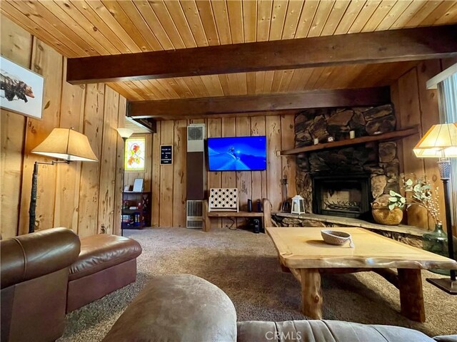 2076 8th Ln, Big Bear City, CA 92314 - carpeted living area featuring wooden walls, wood ceiling with exposed beams, and a stone fireplace