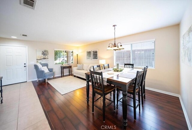29075 Vermillion Ln, Menifee, CA 92587 - dining room with baseboards, a chandelier, wood finished floors, and recessed lighting