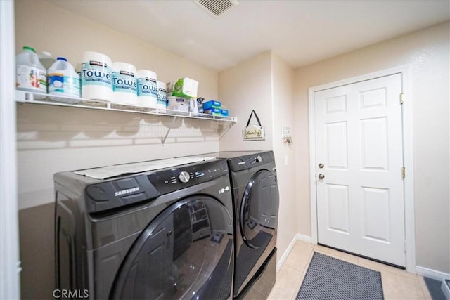 29075 Vermillion Ln, Menifee, CA 92587 - laundry room with washing machine and clothes dryer, light tile patterned floors, and baseboards