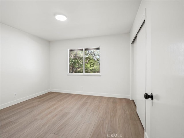 38537 Desert View Dr, Palmdale, CA 93551 - unfurnished bedroom featuring light wood-type flooring, a closet, and baseboards