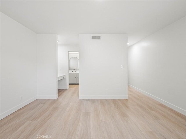 38537 Desert View Dr, Palmdale, CA 93551 - spare room with light wood-style floors, baseboards, and a sink